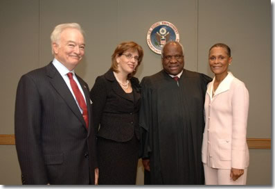 Pictured from left to right are Ronald S. Cooper, EEOC General Counsel; Leslie E. Silverman, EEOC Vice Chair; Clarence Thomas, Supreme Court Associate Justice, and Naomi C. Earp, EEOC Chair