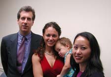 Charging Party Jennifer James (center) is pictured with her baby. Standing next to her are EEOC Trial Attorney Kam Wong (right) and private counsel James A. Brown (left)